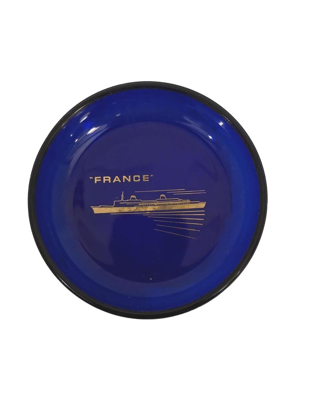 Vintage cobalt blue glass dish featuring the SS France ocean liner.